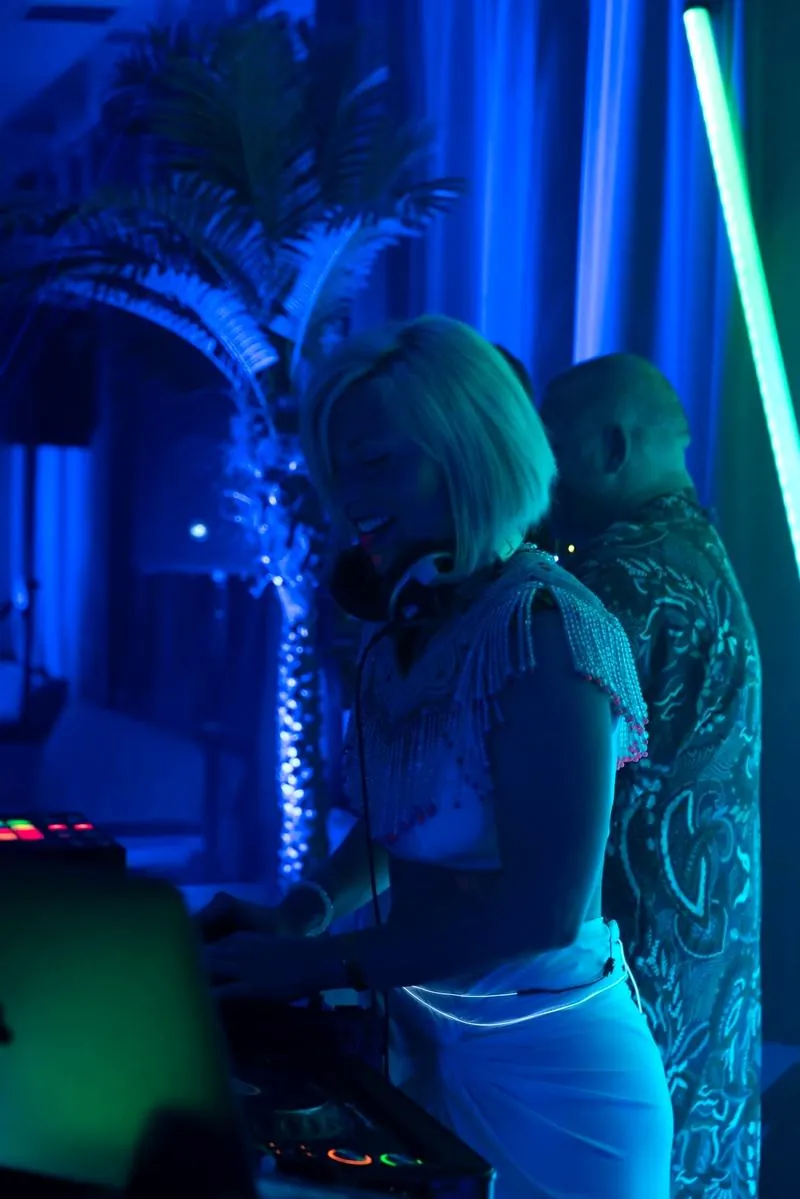 Daniela DJing in blue light at Bogart House in Brooklyn